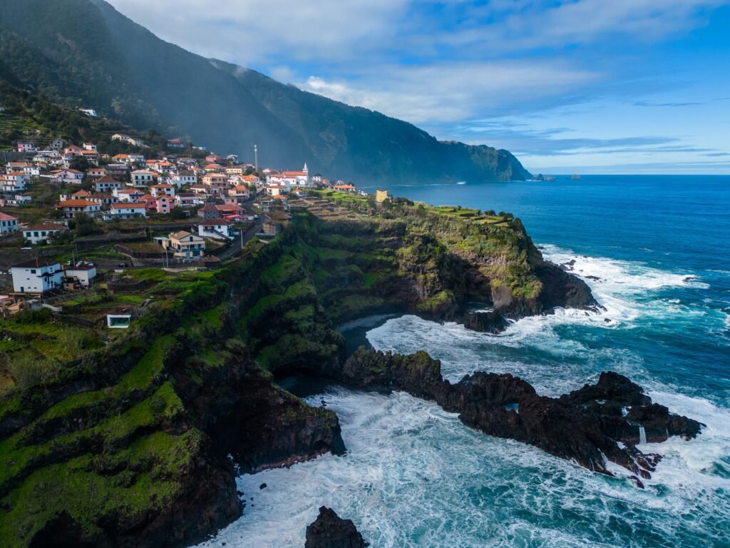 A breathtaking view of Seixal, Madeira with rugged cliffs and the Atlantic Ocean.